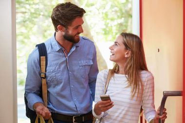 Young Woman Couple Home For Work With Shopping