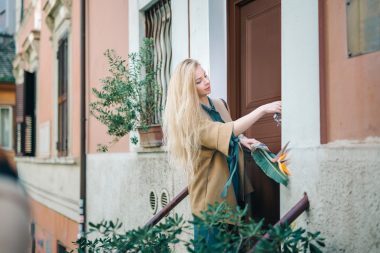 real estate young woman city building door customer